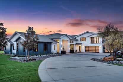 Modern farmhouse at 2111 High Knoll Circle at sunset
