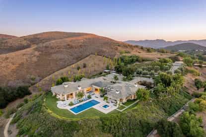 Aerial view of 1300 Woodland Grove Court hillside estate